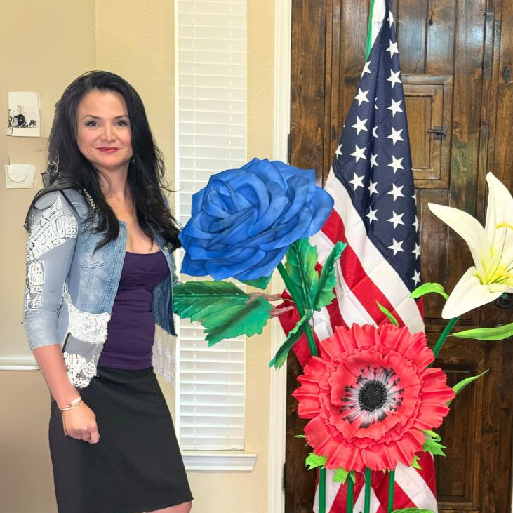 Patriotic American flag decor with giant red, white, and blue foam flower arrangement for Fourth of July events