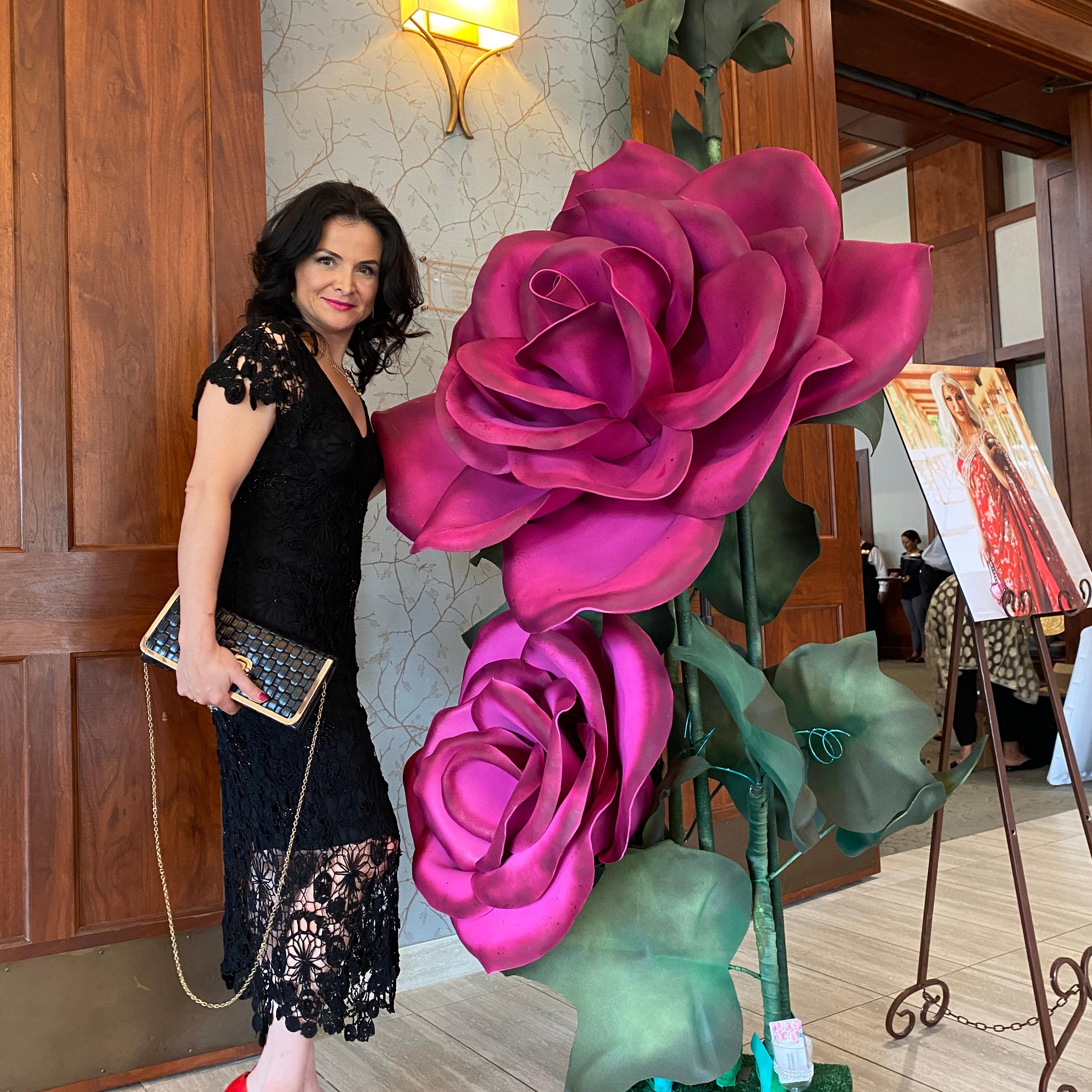 Fuschia red giant rose floor arrangement for corporate event decor and office lobby installations
