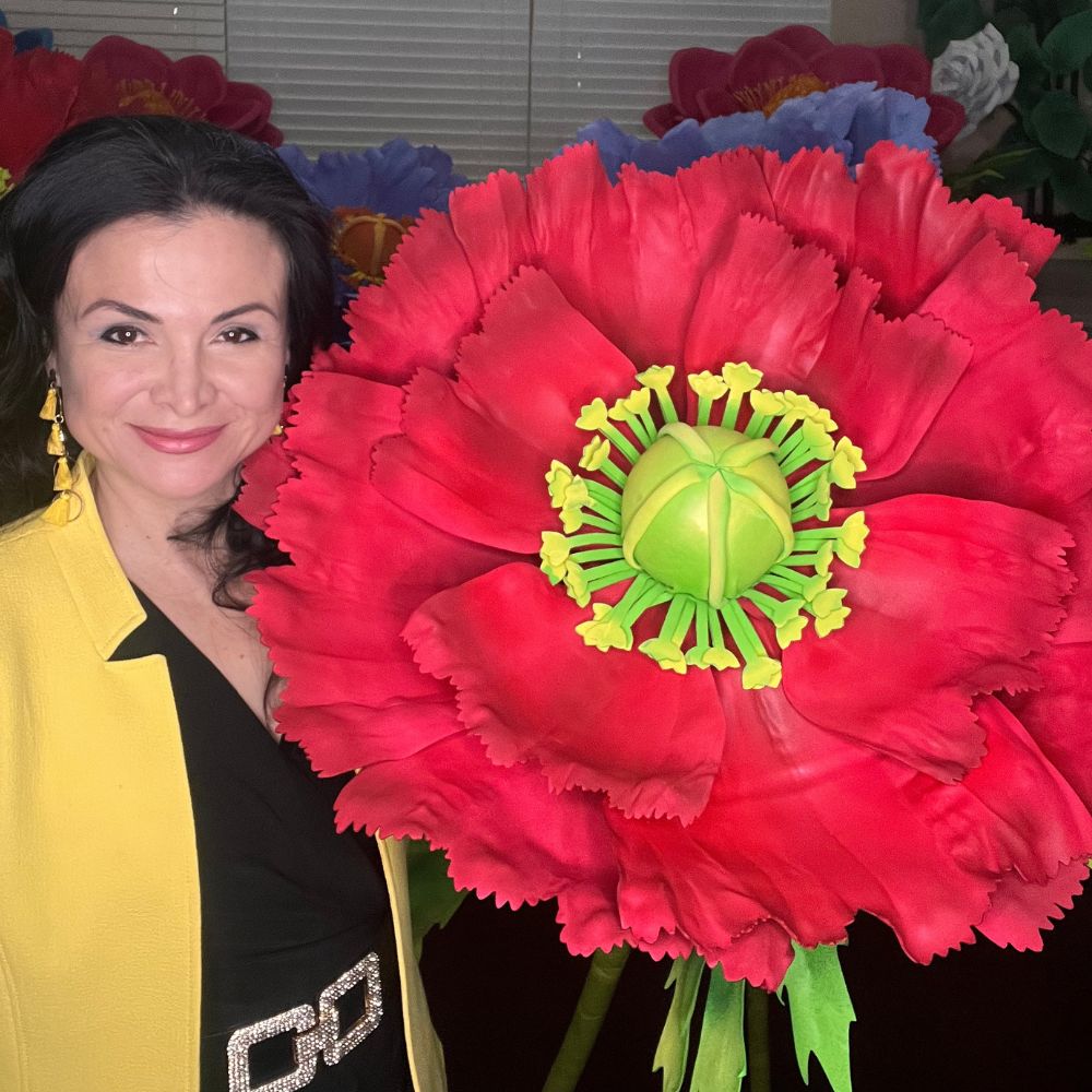 Giant red poppy foam flower close-up showing vivid red petals and dark center from pre-cut DIY kit