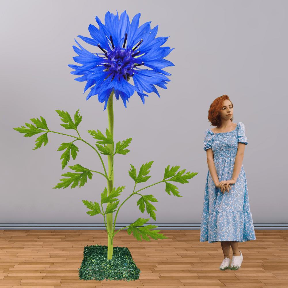 Giant blue cornflower foam flower display for agricultural events and farm-themed installations