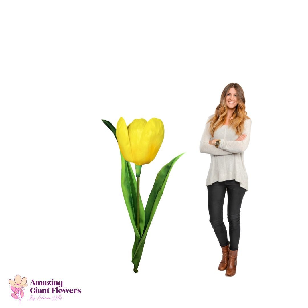 Woman standing next to completed 6-foot tall giant Dutch tulip showing scale and freestanding assembly