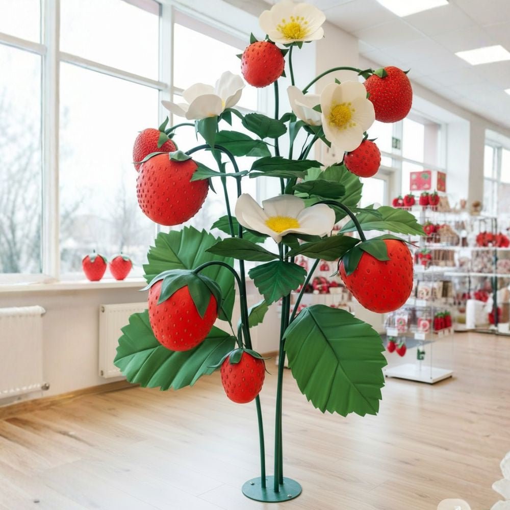 Giant strawberry blossom flower display with white petals and yellow center for agricultural events