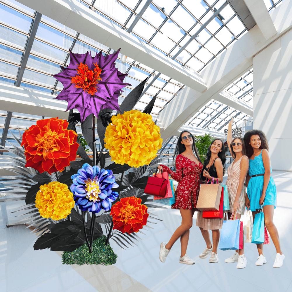 Halloween seasonal display with giant foam flowers in orange, purple, and black for haunted event decorations