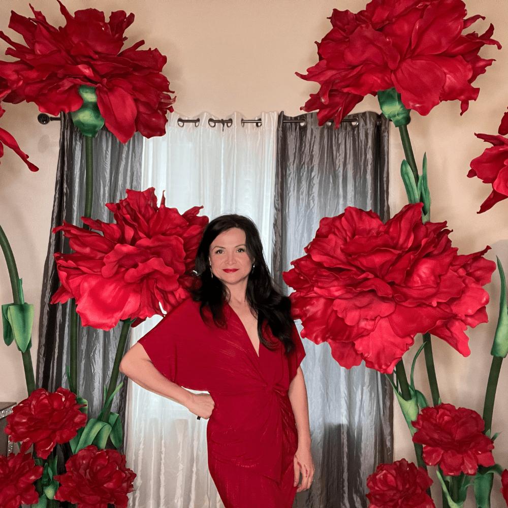 Woman with giant foam flowers created for Broadway shows and theatre event signature installations