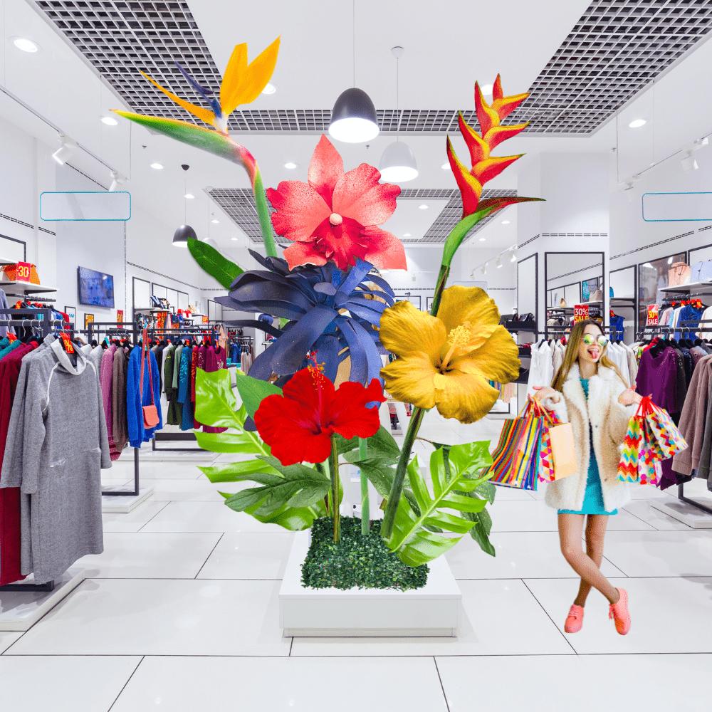 Tropical summer display with giant foam flowers in vibrant orange, pink, and green colors for seasonal events