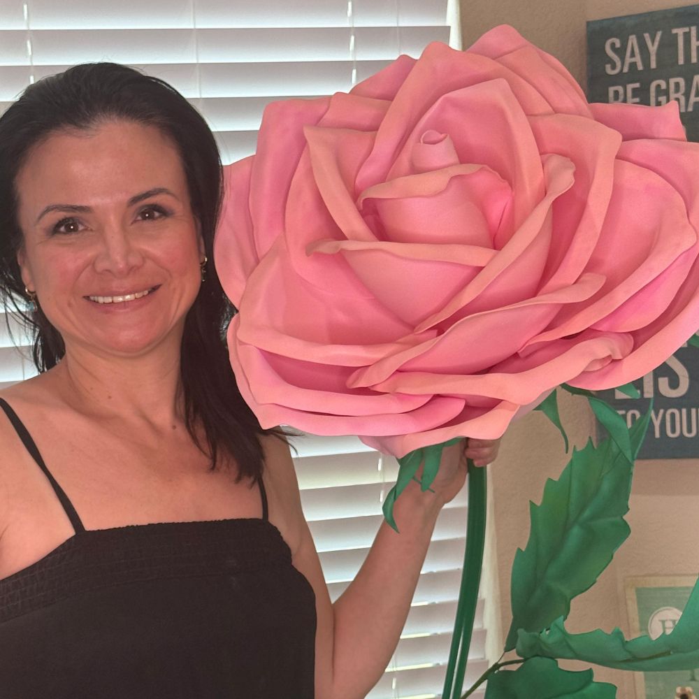 Completed giant red rose foam flower from DIY kit showing classic rose shape with layered crimson petals